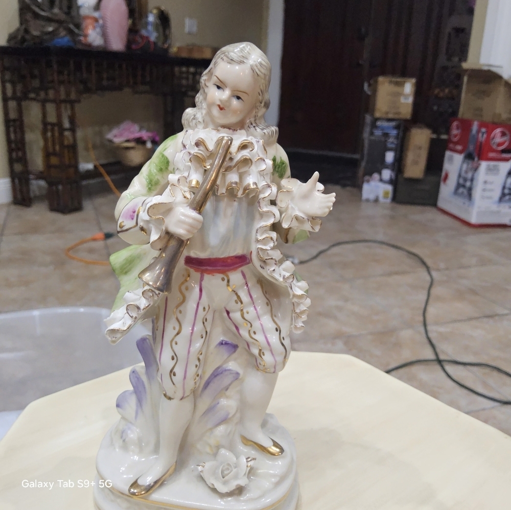 Charming Ceramic Musician Figurine with Green and Purple Accents